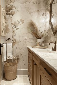 a bathroom with two sinks and a large mirror above the sink is decorated in neutral tones