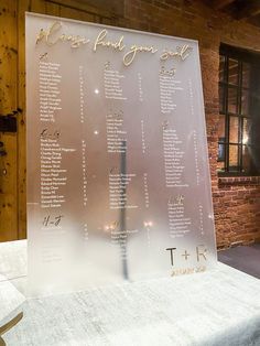 a wedding seating chart is displayed on a table