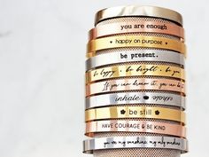 "Personalized Stacking Bracelet / Layering Bracelet / Personalized Bracelet / Engraved Cuff / Custom Engraving / Mantra Bracelet - Thin ECB What's your Mantra? Our thin cuff can be engraved with an inspirational message, saying, quote, song line, scripture, names, dates, or coordinates for the perfect personalized gift! Made with the highest quality stainless steel materials with a glossy mirror finish, or brushed satin finish. Packaged in our Tom Design logo-stamped gift boxes with optional gif Impress Art, Personalized Cuff Bracelets, Gold Bar Necklace Personalized, Custom Bangle, Random Products, Bracelet Layering, Mantra Bracelet, Engraved Cuff, Delicate Gold Necklace