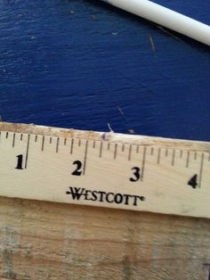 a ruler with the word westcott on it is next to a pencil and eraser