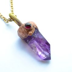 Amethyst and garnet pendant Precious stone necklace Boho jewelry  Amethyst necklace Enchanted forest jewelry gift for mom, for grandma   AMETHYST Amethyst is known as the stone of harmony, transmutation and spirituality. She corresponds to the 6th chakra, located between the eyebrows. She helps calm the mind and relax us, thus promoting the connection with our intuition. It is for this reason that amethyst is usually a good complement to the practice of meditation, either holding the mineral in Spiritual Gemstone Crystal Necklace For Her, Spiritual Crystal Necklace With Gemstone For Her, Spiritual Crystal Necklaces With Gemstone For Her, Spiritual Crystal Gemstone Necklaces As Gift For Her, Bohemian Gemstone Necklaces As Gift For Her, Spiritual Gemstone Jewelry Gift, Spiritual Gemstone Jewelry As A Gift, Spiritual Purple Pendant Jewelry, Spiritual Amethyst Jewelry For Gifts