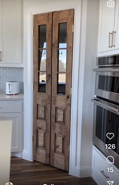 an open door in a kitchen next to a stove top oven and microwave on the wall