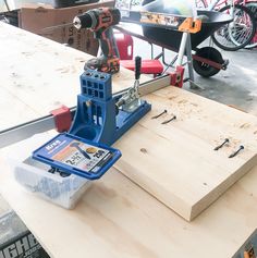 a piece of wood being worked on with a drill and screwdriver attached to it