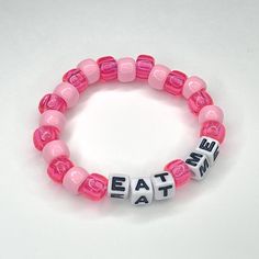 "\"Eat me\" stretchy beaded bracelet Made to order! Please include wrist measurement in centimeters (: Check out our custom listings for more color and word options!" One Word Bracelet Ideas, Bed Bracelet Ideas, Sub Bracelet, Pink Bracelets Ideas, Cute Bracelet Making Ideas, Candi Bracelet Idea, Candy Bead Bracelet Ideas, Funny Kandi Bracelets Sayings, Diy Bracelet Designs Beads