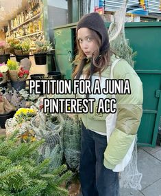 a woman standing in front of plants with the caption petition for a julia pinterest acc