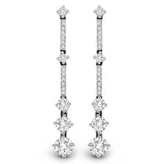 Long, lean and so elegant, these diamond drop earrings will take her breath away. Crafted in 14K white gold, each linear diamond-lined drop features larger diamond stations that catch the eye and add dimension to the designs. A fashion-forward look perfect for the special evening out, these earrings dazzle with 2 cts. t.w. of diamonds and are finished with a bright polished shine. The earrings secure comfortably with friction backs. Luxury Linear Diamond Earrings With Single Cut Diamonds, Luxury Linear Earrings With Single Cut Diamonds For Anniversary, Formal Dangle Linear Earrings With Single Cut Diamonds, Formal White Gold Linear Earrings With Single Cut Diamonds, White Diamond Linear Earrings With Prong Setting, Luxury White Diamond Linear Earrings, Diamond White Brilliant Cut Linear Earrings For Formal Events, Formal White Gold Linear Earrings With Prong Setting, Elegant White Gold Linear Earrings With Single Cut Diamonds