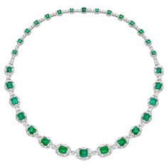 Radial Emeralds by Sunita Nahata Fine Design. This collection features vibrant green emeralds set on a bed of stunning White diamonds set in white gold. This is a dainty and delicate bridal necklace that still exudes a glamorous and luxurious look. Emerald Necklace in 18Karat White Yellow Gold with White Diamond. Emerald: 1.52 carat, 7.30X6.50X4.60mm size, octagon shape. Emerald: 1.31 carat, 7.10X6.00X4.30mm size, octagon shape. Emerald: 1.09 carat, 6.80X6.00X4.10mm size, octagon shape. Emerald: Elegant Green Necklace With Pave Setting, Green Diamond Pave Setting Jewelry, Fine Jewelry Green Emerald Necklace With Brilliant Cut, Green Diamond Jewelry With Pave Setting, Emerald Necklace With Diamonds And 17 Jewels, Fine Jewelry Emerald Necklace With Brilliant Cut, Exquisite Green Necklace With Brilliant Cut, Luxury Hand Set Round Emerald Necklace, Luxury Hand-set Round Emerald Necklace