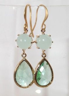 Seafoam and Erinite Green crystal Teardrop Gold Earrings, Wedding Statement Jewelry, Mint Julep Green pastel Double drop Earrings- Etsy GiftBeautiful  and elegant Bridal Airy Seafoam Mint Julep Crystal Teardrop EarringsThese are feminine, fabulous looking:wonderful framed Crystal Green Teardrops and pastel pale Mint round Domed connectors - all in Gold plated bezel setFabulous chic feminine look -These wonderful earrings smartly finish off your look for the elegant everyday or any special occasi Elegant Green Teardrop Crystal Earrings, Green Teardrop Dangle Earrings For Wedding, Green Teardrop Earrings For Wedding, Green Teardrop Wedding Earrings, Green Crystal Wedding Earrings With Ear Wire, Green Teardrop Jewelry For Bridesmaid Gift, Crystal Teardrop Earrings, Gold Earrings Wedding, Crystal Green