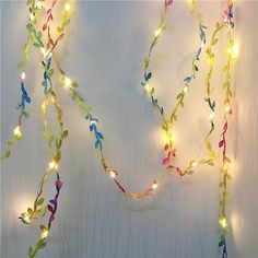 a string of lights hanging from the side of a wall