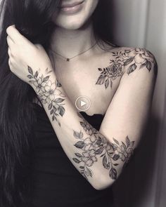 a woman with long black hair and tattoos on her arms is posing for the camera