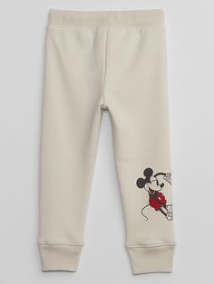 Soft, comfy fleece. Drawcord ties at elasticized waistband are functional for sizes 2T-5T. Gap logo at hip. Mickey Mouse and Minnie Mouse graphic at leg. Banded cuffs. #871929 Mickey Mouse And Minnie Mouse, Tan Chinos, Gap Logo, American Brand, Baby Gap, Disney Mickey Mouse, Disney Mickey, Casual Pants, Minnie Mouse