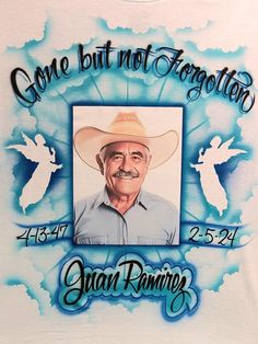 a t - shirt with an image of a man wearing a cowboy hat and the words gone but not forgotten