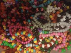 many different colored beads are stacked together