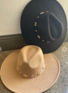 This Banded with Charms Hat is the perfect accessory to add a touch of sophistication and exclusivity to your look. Crafted in a wide brim fedora style, this luxurious piece features a stud trim and a 57CM circumference, along with an adjustable string for the perfect fit. Elevate your wardrobe with a timelessly classic hat. Chic Adjustable Cream Hat Bands, Bohemian Wide Brim Cream Fedora, Bohemian Cream Wide Brim Fedora, Adjustable Brimmed Cream Fedora, Cream Bohemian Brimmed Hat, Fedora Style, Wide Brim Fedora, Classic Hats, Wide Brimmed