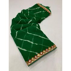 Green colored saree is made from georgette fabric which is highlighted with beautiful printed with sequince embroidered lace border work as shown. comes along unstitched banglori silk blouse piece which you can customise as per your design/style. Occasion - You can wear this saree for casual and daily and ideal for any fashionista. Note:- The actual product may differ slightly in color and design from the one illustrated in the images when compared with computer or mobile screen. Measurements: S Festival Georgette Pre-draped Saree With Printed Border, Bollywood Georgette Saree With Border, Bollywood Style Georgette Saree With Border, Festival Georgette Pre-draped Saree With Border, Multicolor Georgette Blouse With Bandhani Print, Georgette Dupatta With Printed Border For Festivals, Multicolor Bandhani Print Georgette Saree, Unstitched Georgette Saree With Border, Green Georgette Saree With Embroidered Border