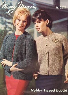 two women standing next to each other wearing sweaters