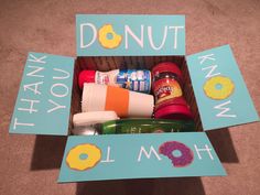 an open box with various items in it that say donut and i love you mom