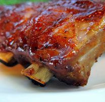 a piece of meat sitting on top of a white plate