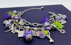 The perfect gift for her on Christmas, Birthday, Anniversary, Mothers Day or just because. You, your daughter, grandaughter, best friend, wife or girlfriend will love this bracelet to add to their jewelry collection. Jump into spring with this beautiful double link silver charm bracelet with abundant silver charms, purple acrylic flower and faux pearl beads, ready to be personalised with your chosen letter charm. Charms include: Hearts(3),Scottie dog,You are always in my heart,Butterfly,Lock and Bohemian Purple Charm Bracelet Gift, Purple Charm Bracelet Jewelry, Purple Flower Charm Jewelry, Adjustable Purple Bangle Charm Bracelet, Adjustable Nickel-free Purple Charm Bracelet, White Jewelry Box, Silver Charm Bracelet, Etsy Bridesmaid Gifts, Letter Charms