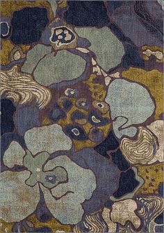 an area rug with various colors and designs on it, including blue, green, yellow and brown flowers