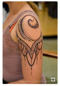 a woman with a tattoo on her arm