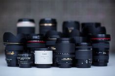 a bunch of camera lens sitting on top of each other