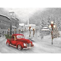 a red truck driving down a snow covered street next to a christmas tree and lights