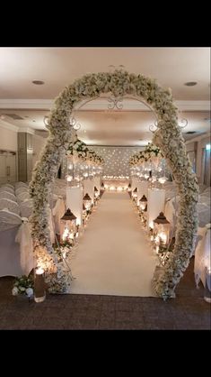 an aisle decorated with flowers and candles