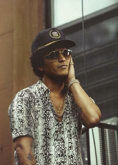 a man wearing sunglasses and a baseball cap