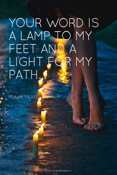 a woman's feet with candles on the ground and an inspirational quote above it