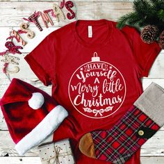 a red t - shirt that says, whatever you want for christmas is on it