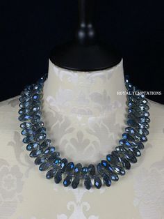 This necklace is a feast for the eyes with over 60 faceted and irridized ocean blue crystals. The crystals are so beautifully faceted and luminous, they seem to light up on their own. They are complimented with light blue - gray irridized spacer beads between each crystal. This piece is equally at home adorning a dress to a dinner party, or with your favorite sweater and jeans, this will be your favorite go to piece! It has been finished with the most secure of clasps, a sterling silver lobster Blue Crystal Drop Necklaces, Blue Faceted Drop Necklaces, Blue Crystal Drop Necklace, Sapphire Crystal Teardrop Necklace, Blue Faceted Drop Necklace, Sapphire Teardrop Crystal Necklace, Teardrop Crystal Faceted Necklace, Faceted Teardrop Crystal Necklace, Sweater And Jeans