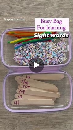 two plastic containers filled with different types of items and words in them, on top of a wooden table