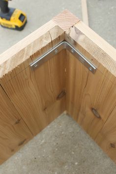 a close up of a wooden door frame with screws on the top and bottom