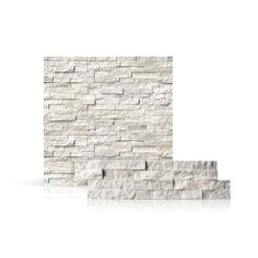 a white brick wall with two steps leading up to the bottom and one on the side