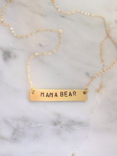 "Personalize this gold bar necklace with any word that has special meaning to you or to a loved one! Give a word of encouragement to someone going through a hard time - \"BRAVE\" Remind her how valuable she is - \"PRICELESS\" Does she light up your day? If so, tell her! - \"SHINE\" Going on a trip? - \"WANDER\" Remind her it's gonna be ok. Keep your chin up - \"HOPE\" ● 16\" chain ● Completely customizable! Just message me! ● Bar measures 40x8mm ● Solid brass bar ● Gold filled chain ● Handmade b Meaningful Everyday Gold Name Necklace, Meaningful Nameplate Necklace For Everyday, Everyday Meaningful Nameplate Necklace, Everyday Hand Stamped Rectangular Necklace, Everyday Rectangular Hand Stamped Necklace, Personalized Dainty Bar Necklace For Everyday, Gold Custom Name Necklace For Best Friend, Custom Name Gold Necklace For Best Friend, Personalized Gold Bar Necklace For Everyday