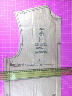 a piece of paper that has been cut out to be used as a sewing pattern