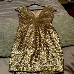 Perfect Party Dress For The Holiday. It’s Brand New Without The Tags. Dressy V-neck Holiday Dresses, Gold V-neck Mini Dress For Formal Occasions, Dressy Sequined V-neck Dress, Dressy V-neck Sequin Dress, Dressy V-neck Dress With Sequins, Gold V-neck Midi Dress For Party, Party Season Sheath Evening Dress, Sheath Evening Dress For Party Season, Gold V-neck Sequin Dress For Formal Occasions