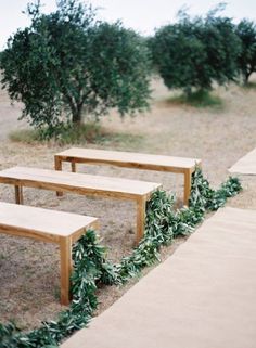 three wooden benches sitting next to each other