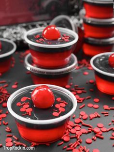 red and black desserts are sitting on the table