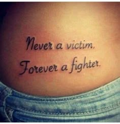 a woman's stomach with the words never a victim, forever a fighter