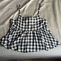 Black And White Checkered Print Babydoll Tank Top Cute Black Cotton Tank Top, Black Cotton Summer Top, Black Cotton Tank Top For Day Out, Cute Black Beach Tops, Summer Sleeveless Black And White Tops, Black And White Sleeveless Top For Summer, Black And White Sleeveless Summer Tops, Sleeveless Black And White Tops For Summer, Babydoll Tank Top