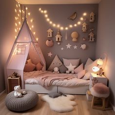 a child's bedroom decorated in pink and grey with lights on the ceiling, bedding and pillows