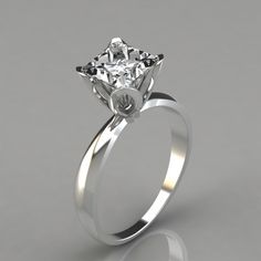 a white gold engagement ring with a single diamond in the center, on a gray background