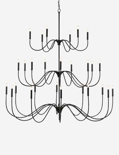 a large chandelier with many lights hanging from it's sides and arms