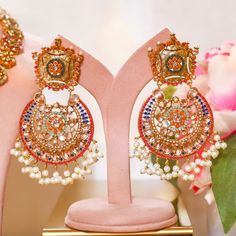 Adorn into the extravagant fusion of grace and royalty! Paint yourself in luscious shades of nauratan stones enhanced by pearl moti hanging with a classic embodiment of ravishing design radiating elegant femininity. Approximate earrings length is 4". Gold-plated on high-quality brass as base metal. Made by order. Kindly allow 5-7 weeks for the delivery of this item. For custom or urgent requests, please contact support@alacouture.com. *Please Note: The multi-colored beadwork might be slightly va Unique Gift Cards, Emerald Color, Create Words, Faux Stone, Base Metal, Free Giveaway, Picture Perfect, Multi Colored, Bead Work