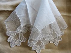 Gorgeous vintage fancy hanky bridal hanky for a modern bride wedding handkerchief. This fine hankie has exquisite, intricate and beautiful lace. It measures 11 inches by 11 inches, fine linen center, in wonderful condition, looks never used. Would be very pretty to frame or make wonderful heirloom quality gifts for the bride or bridal party or any other special occasion. Small enough to be slipped into a greeting card for a lovely gift. Please do view our other beautiful vintage and antique hank Lace Handkerchiefs With Lace Trim For Wedding, Lace Wedding Handkerchiefs With Lace Trim, Elegant Lace Work Handkerchief For Wedding, Elegant Lace Work Wedding Handkerchief, Elegant Lace Work Handkerchiefs Gift, Elegant Lace Wedding Handkerchief, Elegant Wedding Handkerchief With Lace Work, Elegant White Lace Handkerchiefs, Wedding Lace Handkerchief With Lace Work