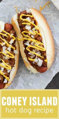 two hot dogs with condiments on them sitting on wax paper and the words coney island hot dog recipe