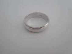 Sterling Silver solid band. Signed 925. Ring is in good used condition, it does have some scratches that can be buffet out by a jeweler. Size 7 Thank you and be sure to check out my other fine listings. https://www.etsy.com/shop/TraderTrudys Have a blessed day. Sterling Silver Thick Band For Formal Occasions, Formal Sterling Silver Thick Band, Classic Sterling Silver Wide Band, Formal Sterling Silver Round Bands, Classic Silver Band Ring, Hallmarked Sterling Silver Band For Formal Occasions, Classic Silver Band Jewelry, Silver Wedding Band, Chic Sunglasses