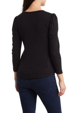 Delicately puffed sleeves bring instant romance to this classic crew neck top that's sure to get tons of compliments. 23" length (size S) Crew neck Three-quarter sleeves Slips on over head 94% rayon, 6% spandex Machine wash, line dry Made in the USA Model Stats: 5'10" height; 34" bust; 27" waist; 35" hips. Model is wearing size S. Fitted Puff Sleeve Tops For Layering, Black Stretch Puff Sleeve Long Top, Fall Fitted Puff Sleeve Top With Gathered Sleeves, Fitted Puff Sleeve Top With Gathered Sleeves For Fall, Fitted Tops With Pleated Sleeves For Fall, Elegant Puff Sleeve Tops For Layering, Fall Crew Neck Top With Gathered Sleeves, Fall Tops With Gathered Sleeves And Crew Neck, Stretch Puff Sleeve Top For Fall